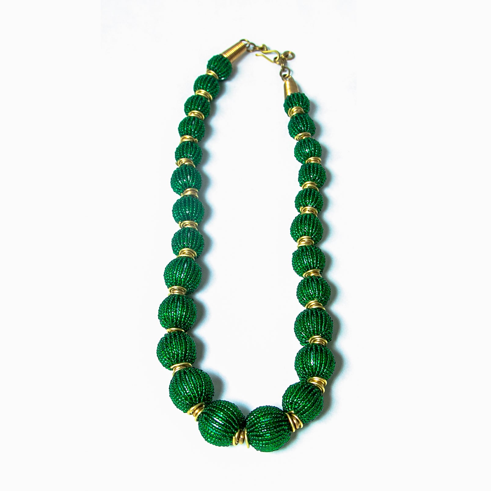 Handcrafted beaded ball necklace featuring vibrant green beads and gold-toned accents, elegantly designed for a stylish and unique look.