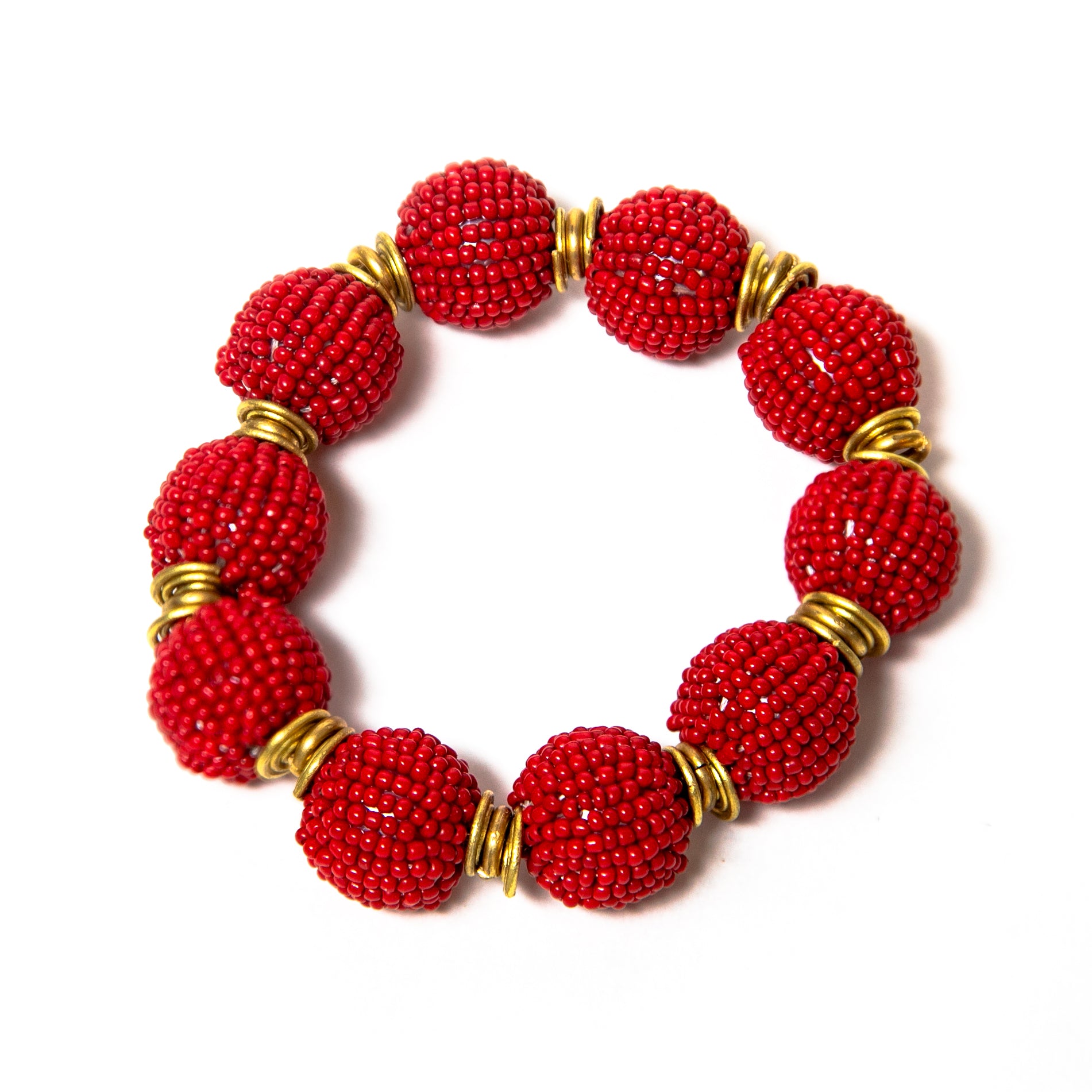 Handcrafted beaded ball bracelet featuring vibrant red beads and gold-toned accents, elegantly designed for a stylish and unique look.